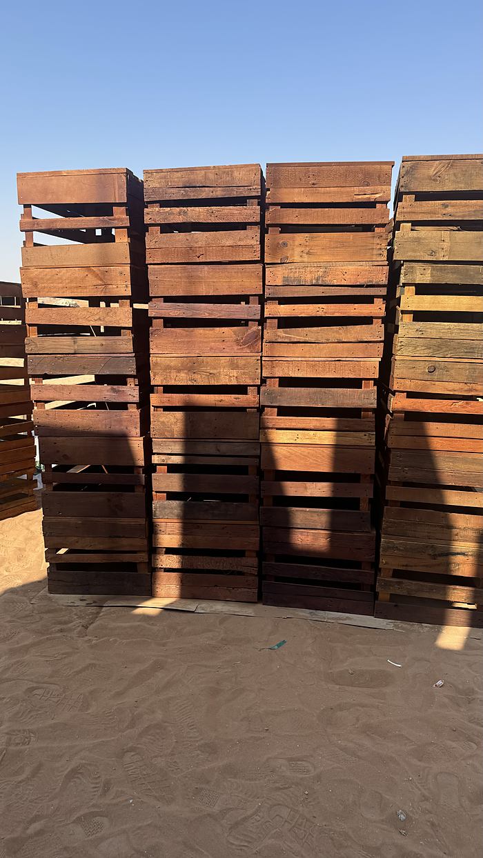 Reclaimed pallets stacked on site