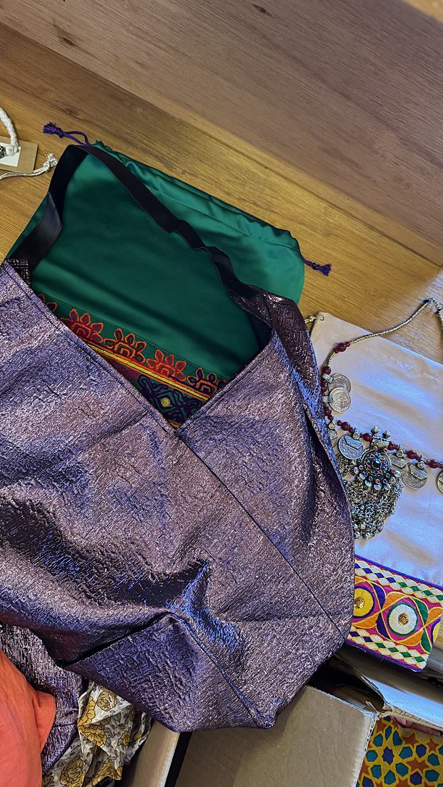Upcycled merchandise bags and pouches made with an Emirati label