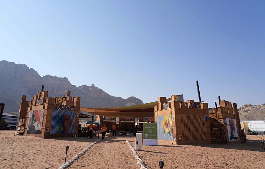 The built Tanweer marketplace — approach from the desert